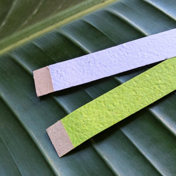 Close up of adhesive tab for seed paper event wristbands