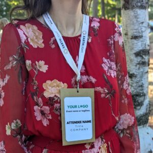 Person in red dress wearing paper name badge holder for eco-friendly event, meeting and conferences with organic cotton sustainable lanyard.