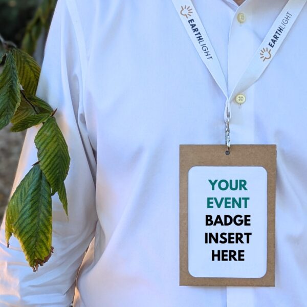 Man in white shirt wearing sustainable, plastic-free conference and event paper name badge holder with eco-friendly, branded lanyard