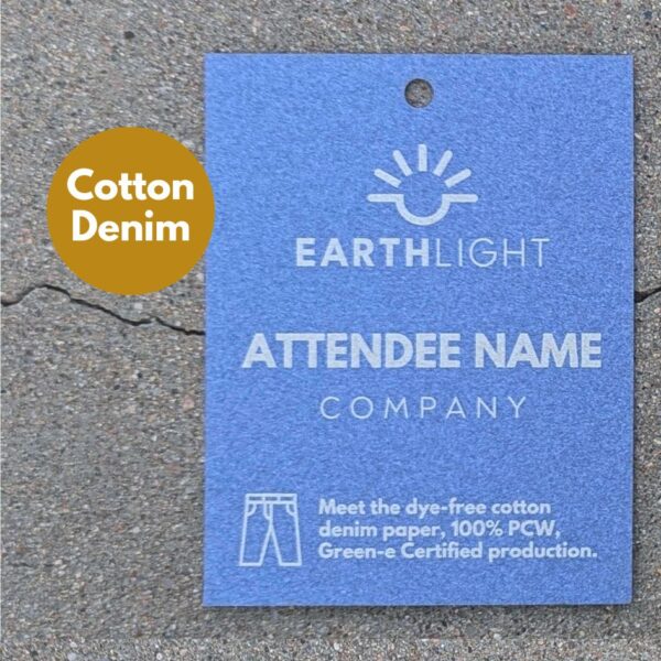 Sustainable, upcycled conference and event name tag lasered into recycled cotton denim paper.