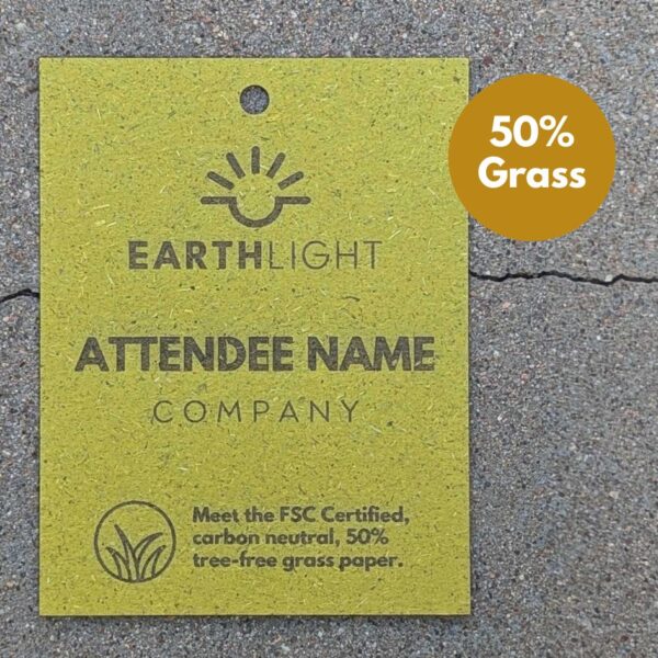 Zero waste, biodegradable event and conference name tag badge from upcycled grass and paper cardstock with laser etch.