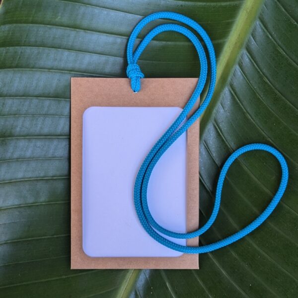 Eco-friendly paper tradeshow and event name badge holder with upcycled deadstock scrap lanyard.