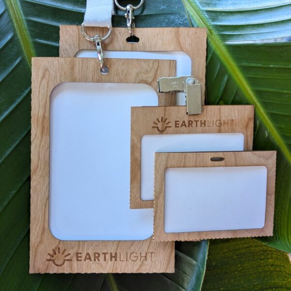 Biodegradable and compostable paperbacked wood name tag and badge holders for sustainable events and conferences