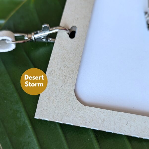 Close up of eco-friendly Desert Storm paper name badge holder for low waste conference and event