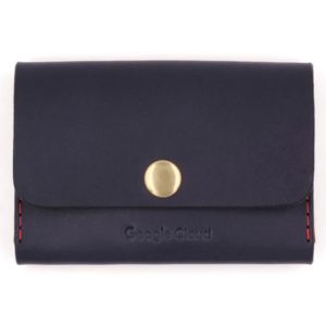 This business card holder is made from premium U.S. full grain vegetable-tanned leather. Shown here in navy blue with the Google Cloud logo debossed on the bottom underneath a brass snap.